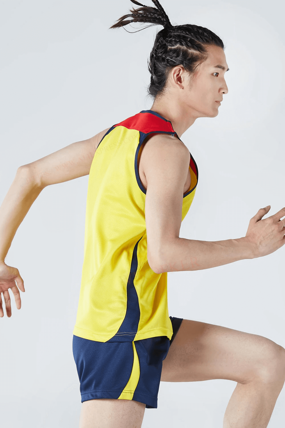 Man wearing Men's Athletic Mesh Tank Top and Shorts Set - SF2042, perfect for quick-drying running and gym workouts.