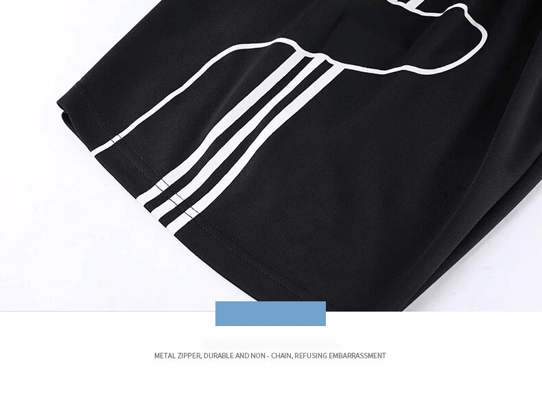 Close-up of men's athletic shorts with white striped design and durable metal zipper on black fabric, highlighting style and functionality.