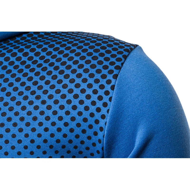 Close-up of blue tracksuit with black polka dot pattern, highlighting the fabric texture and sporty style.