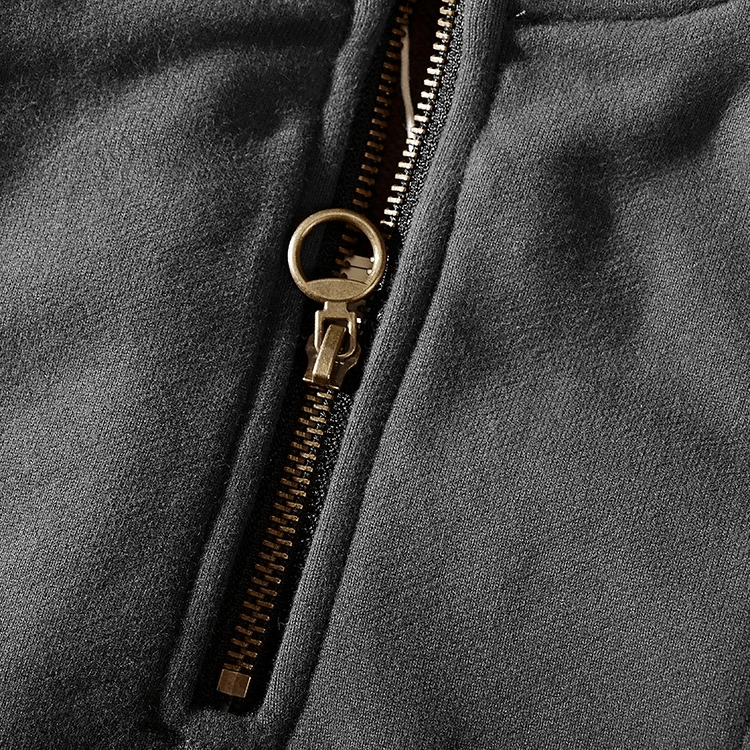 Close-up of a soft cotton turtleneck sweatshirt with a zipper detail, ideal for autumn and winter fashion.