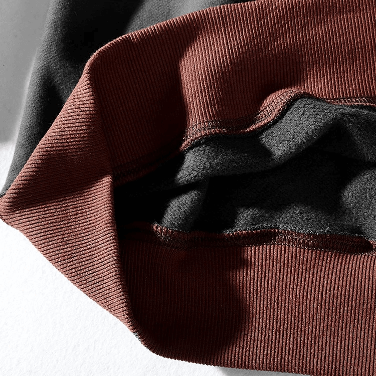 Close-up of men's cotton turtleneck sweatshirt in patchwork design, emphasizing soft texture and versatile style for autumn and winter.