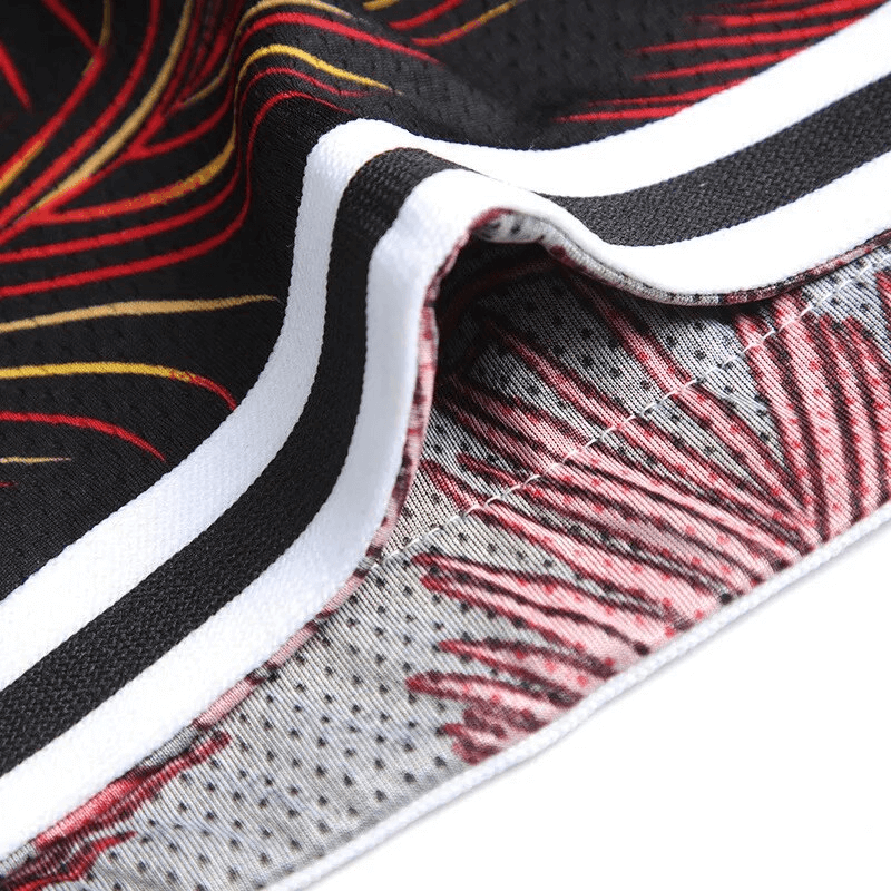 Close-up view of Men's Basketball Sports Elastic Waist Board Shorts fabric with colorful print design. Model: SF1559.