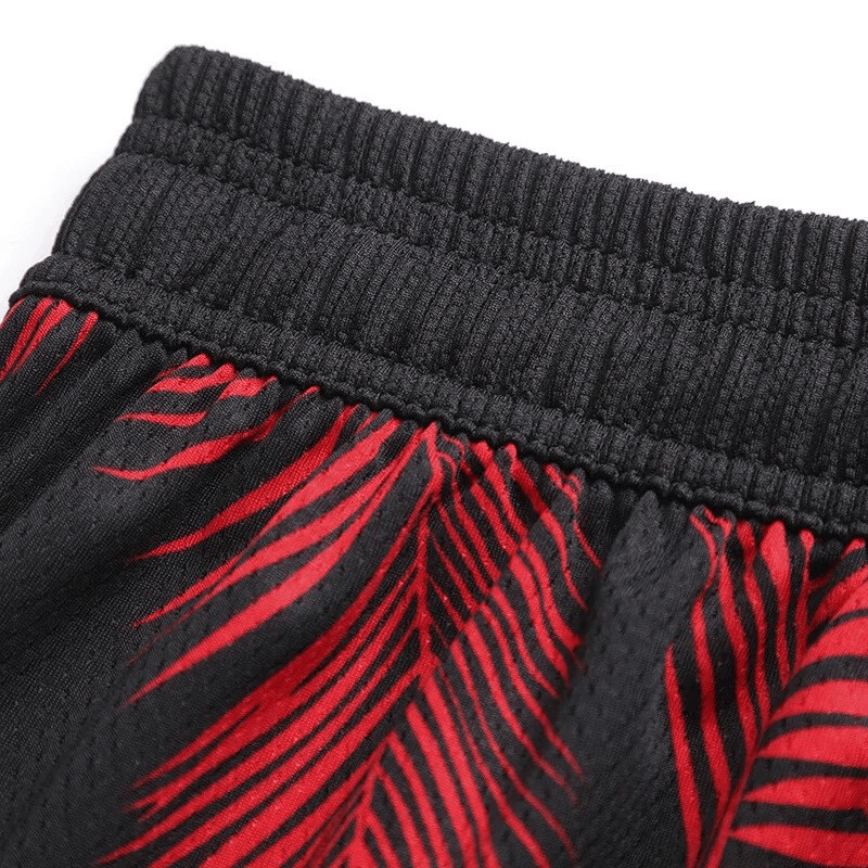 Close-up of Men's Basketball Elastic Waist Board Shorts with red print, showing stretch waistband detail for comfort and mobility.