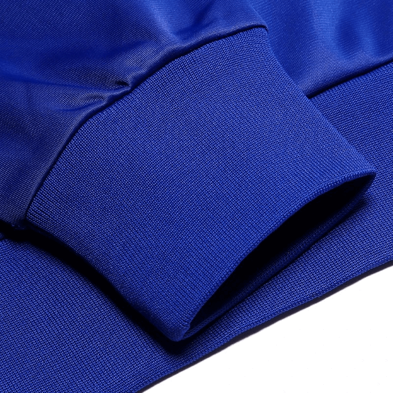 Close-up of a royal blue men's breathable sport jacket cuff made of lightweight microfiber, showcasing seamless design and texture.