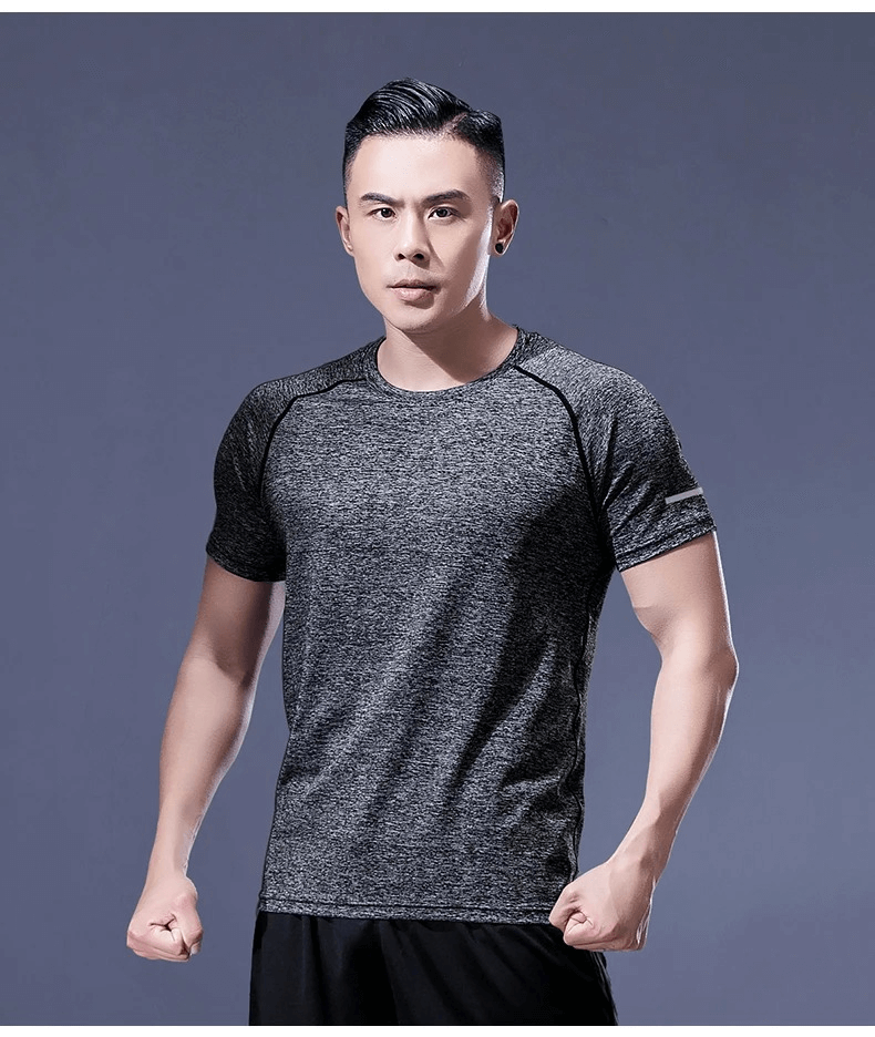 Men's breathable sportswear, short sleeve fitness tee in gray, ideal for gym and track, model showcasing athletic wear design.