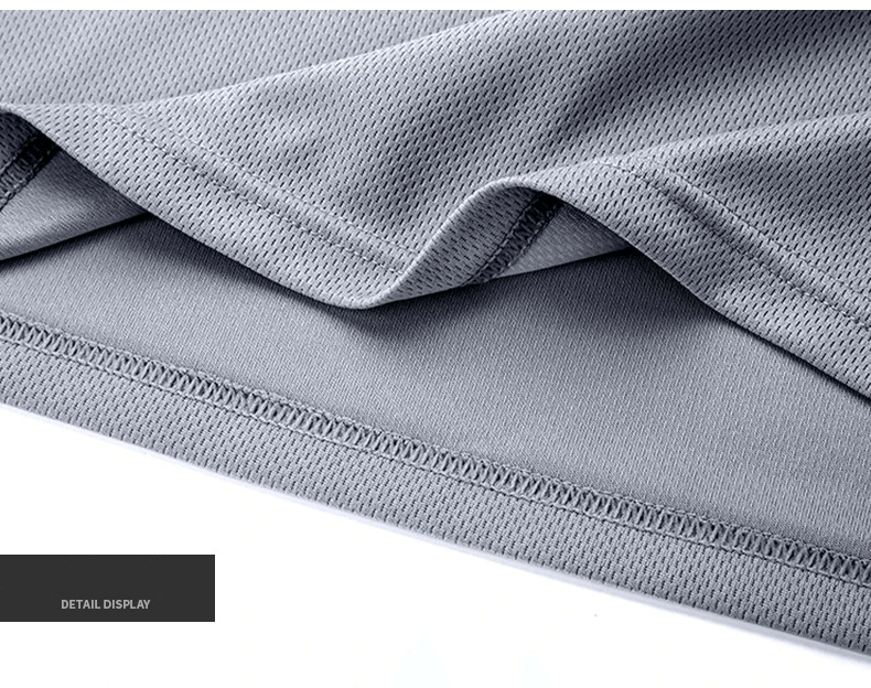 Close-up of gray breathable polyester-spandex men's sportswear fabric, showcasing detailed seam stitching and texture.