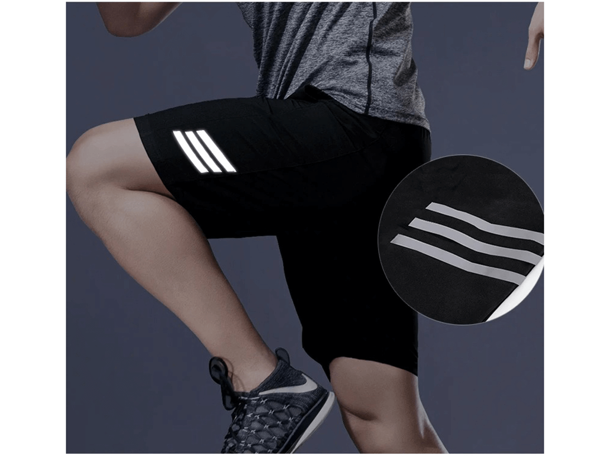 Men's breathable sportswear SF2027, featuring black shorts with reflective stripes and a gray athletic shirt.