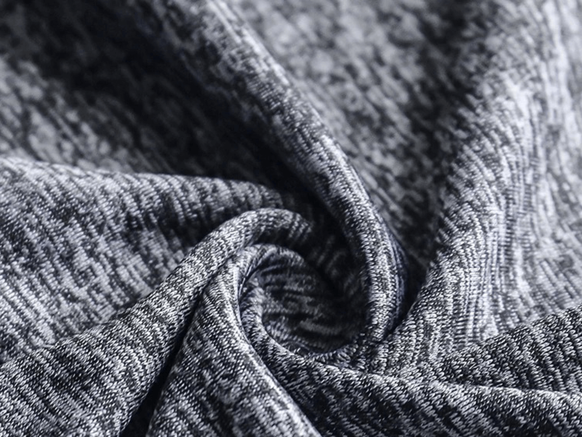 Close-up of breathable polyester-spandex fabric texture, ideal for men's athletic wear like the SF2027 sports set.