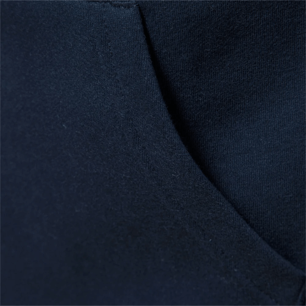 Close-up of navy men's cotton blend sweatshirt fabric showing texture and knit construction for casual wear.