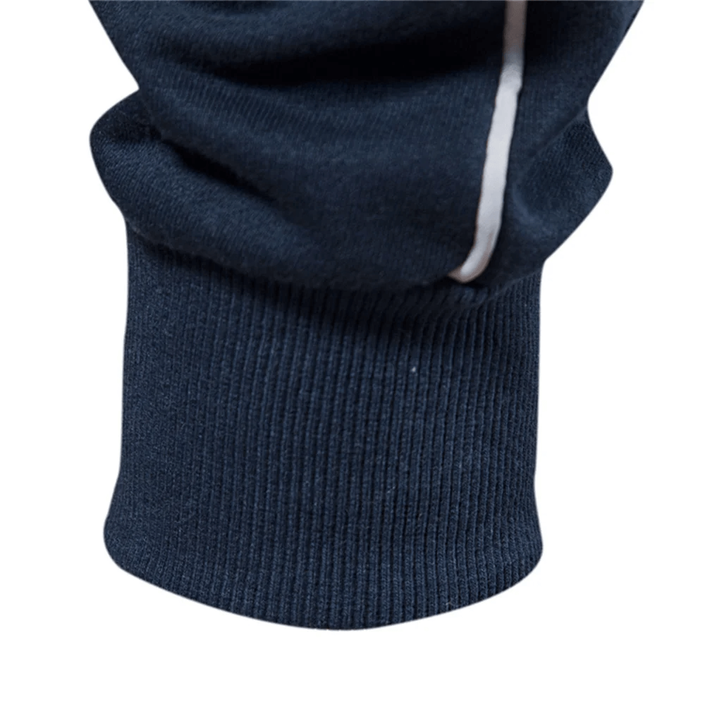 Close-up of men's navy blue cotton blend sweatshirt sleeve, showcasing ribbed cuff detail for comfort and style in casual wear.