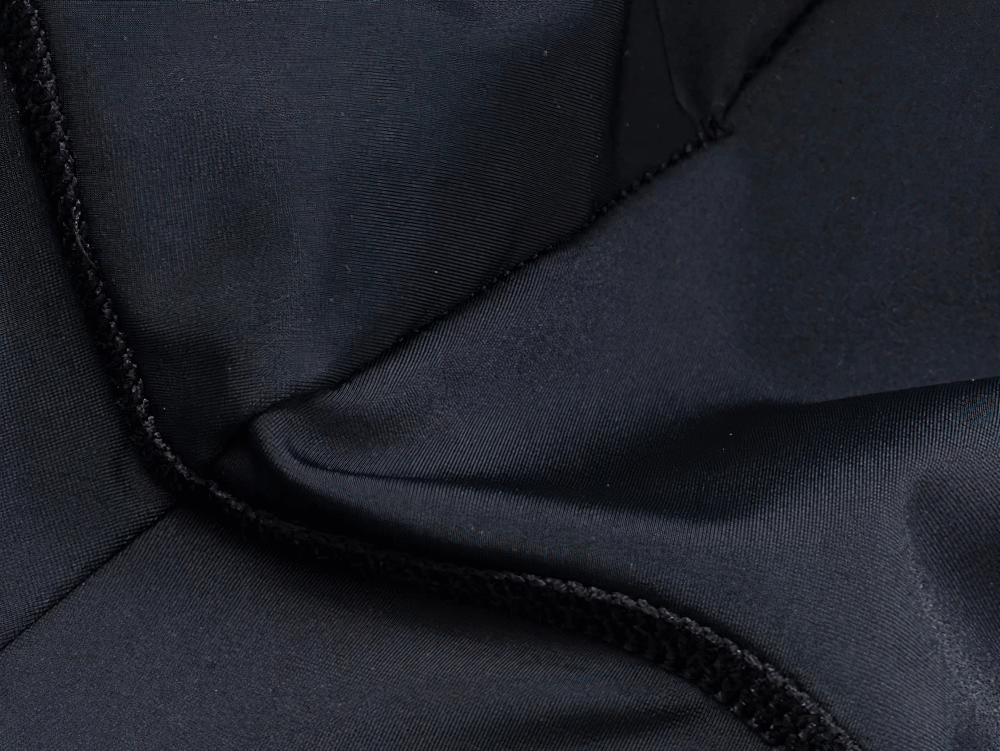 Close-up of breathable fabric used in men's cycling jersey and padded shorts set SF2595, highlighting moisture-wicking properties.