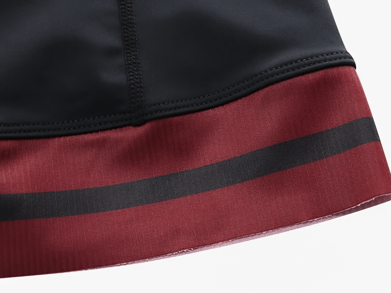 Close-up of men's cycling bib shorts hem with black and red design, from the SF2594 set, ideal for MTB and road bike racing.