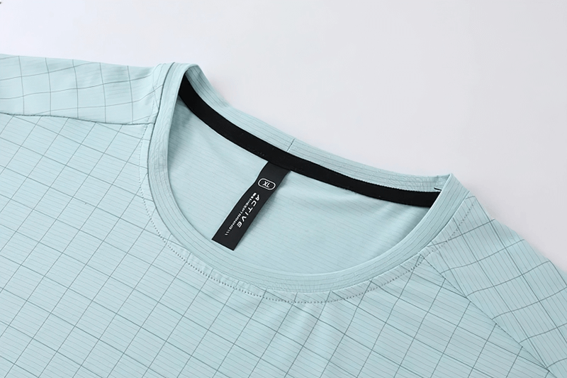 Close-up of Men's Grid-Print Quick-Dry Gym Tee by Fit Clothing, featuring an O-neck collar and breathable fabric for workouts.