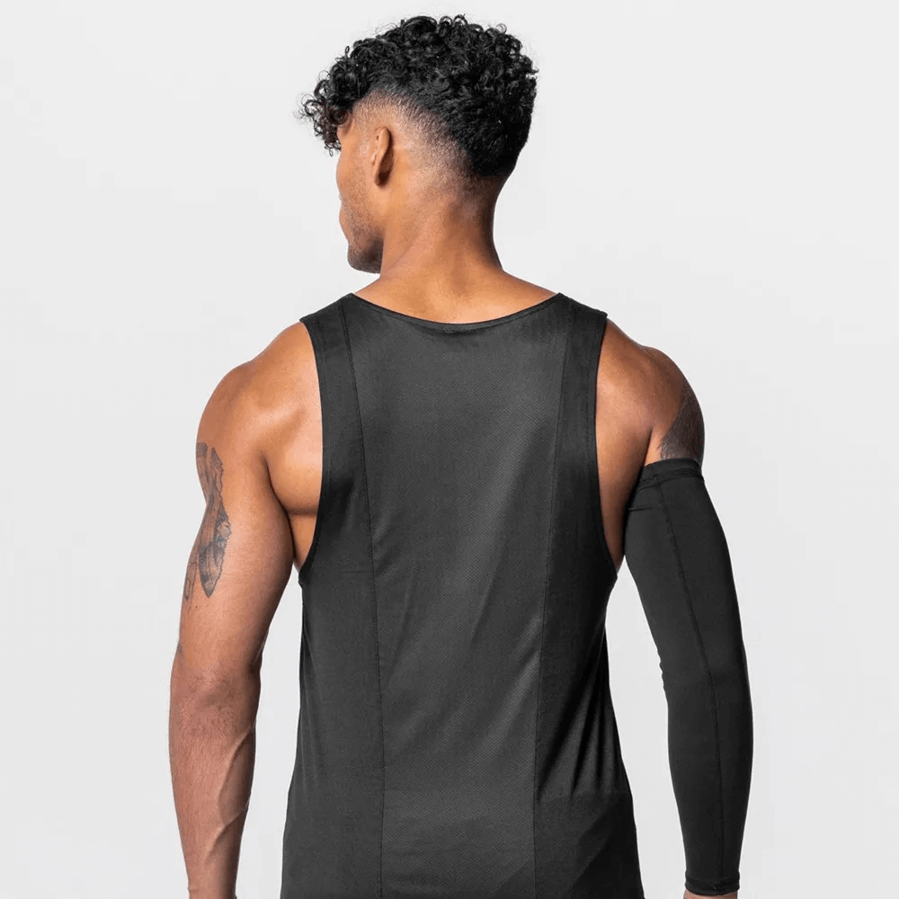 Back view of man wearing black men's gym training O-neck tank top with asymmetric hem, made from breathable polyester, perfect for workouts.