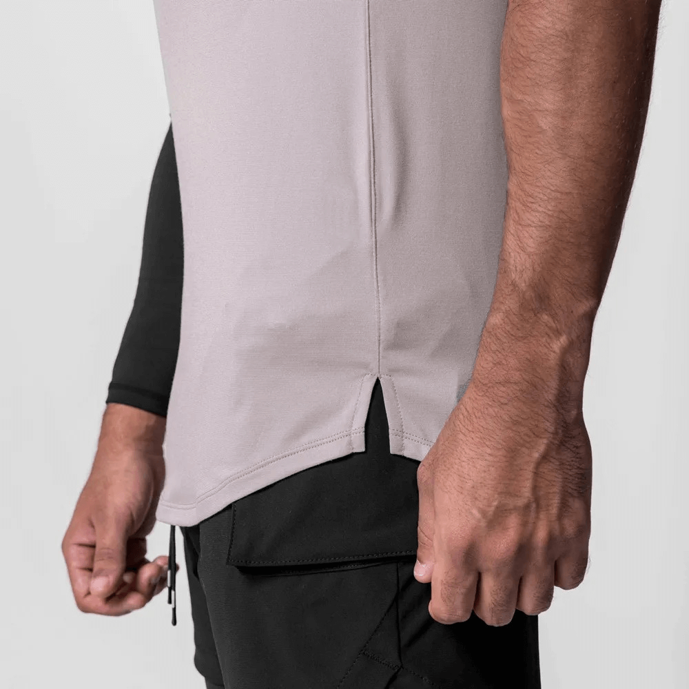 Stylish men's asymmetrical hem tank top for gym, featuring a solid pattern and breathable polyester for optimal training comfort.