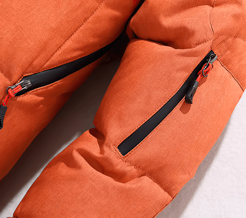 Close-up of orange men's hooded duck-down winter jacket with multiple pockets and zipper details.