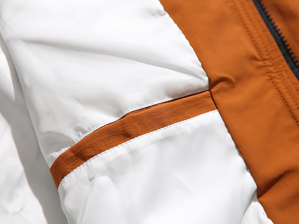 Detail view of Men's Hooded Jacket SF2263 showing the orange and white color contrast and durable polyester fabric.