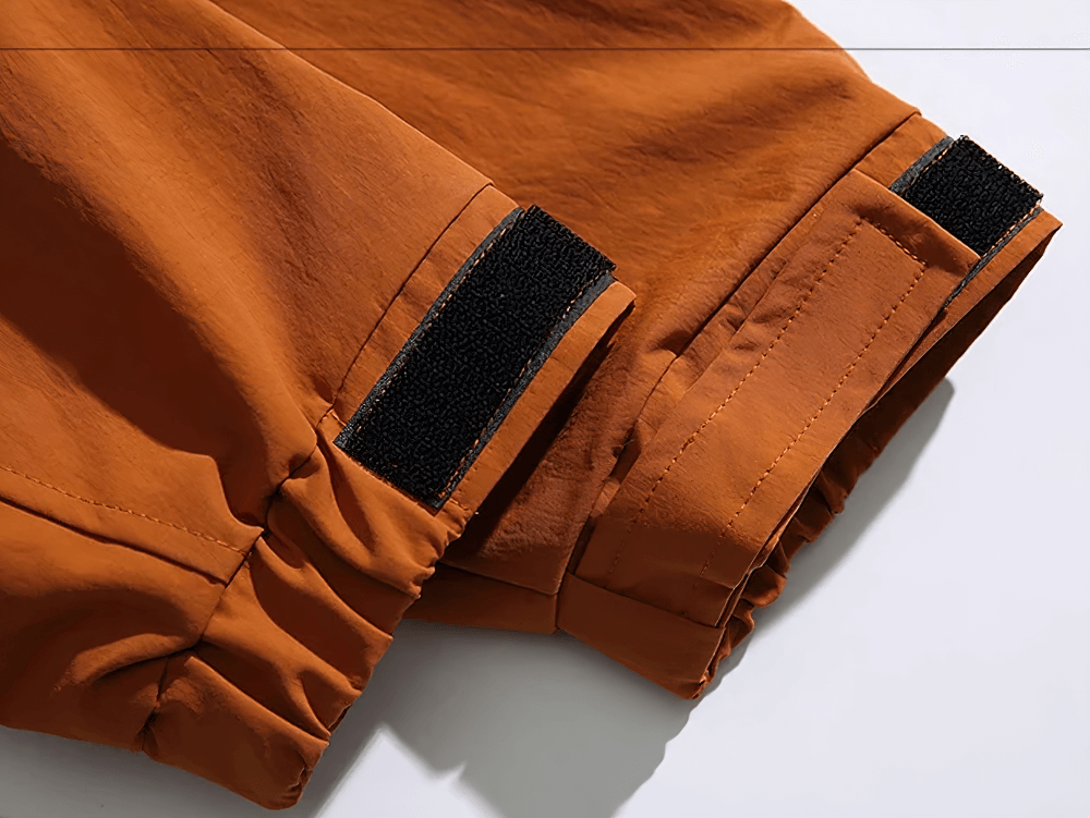 Close-up view of cuff details on durable men's hooded jacket SF2263, featuring adjustable velcro closure for a secure fit.