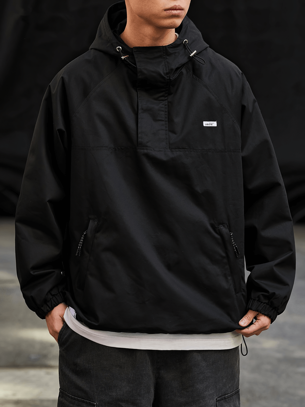 Men's black hooded pullover streetwear jacket SF2271 with half-zip and adjustable hood.