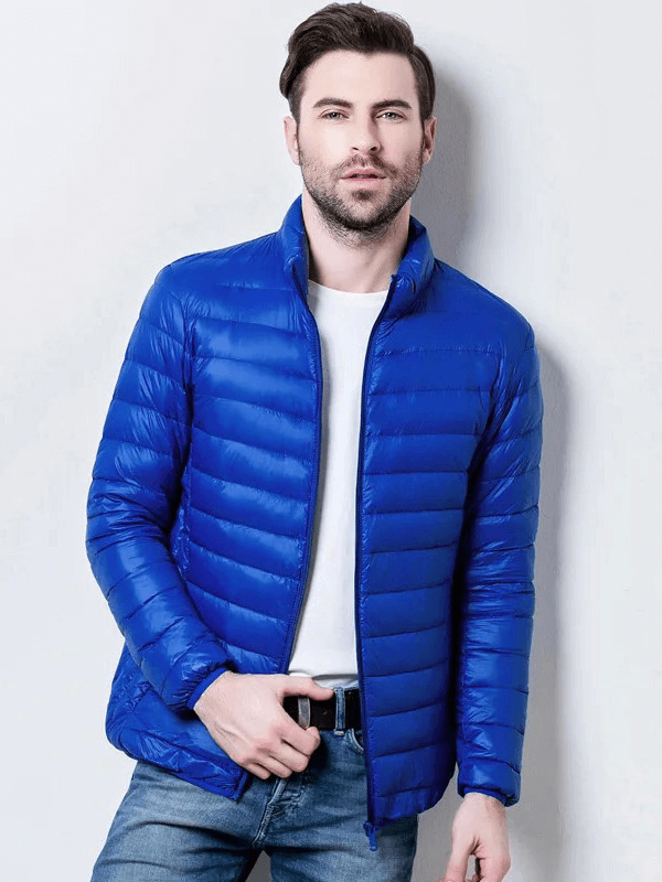 Stylish men's blue insulated down jacket with stand collar, perfect for outdoor activities. Made of durable nylon and filled with duck-down.