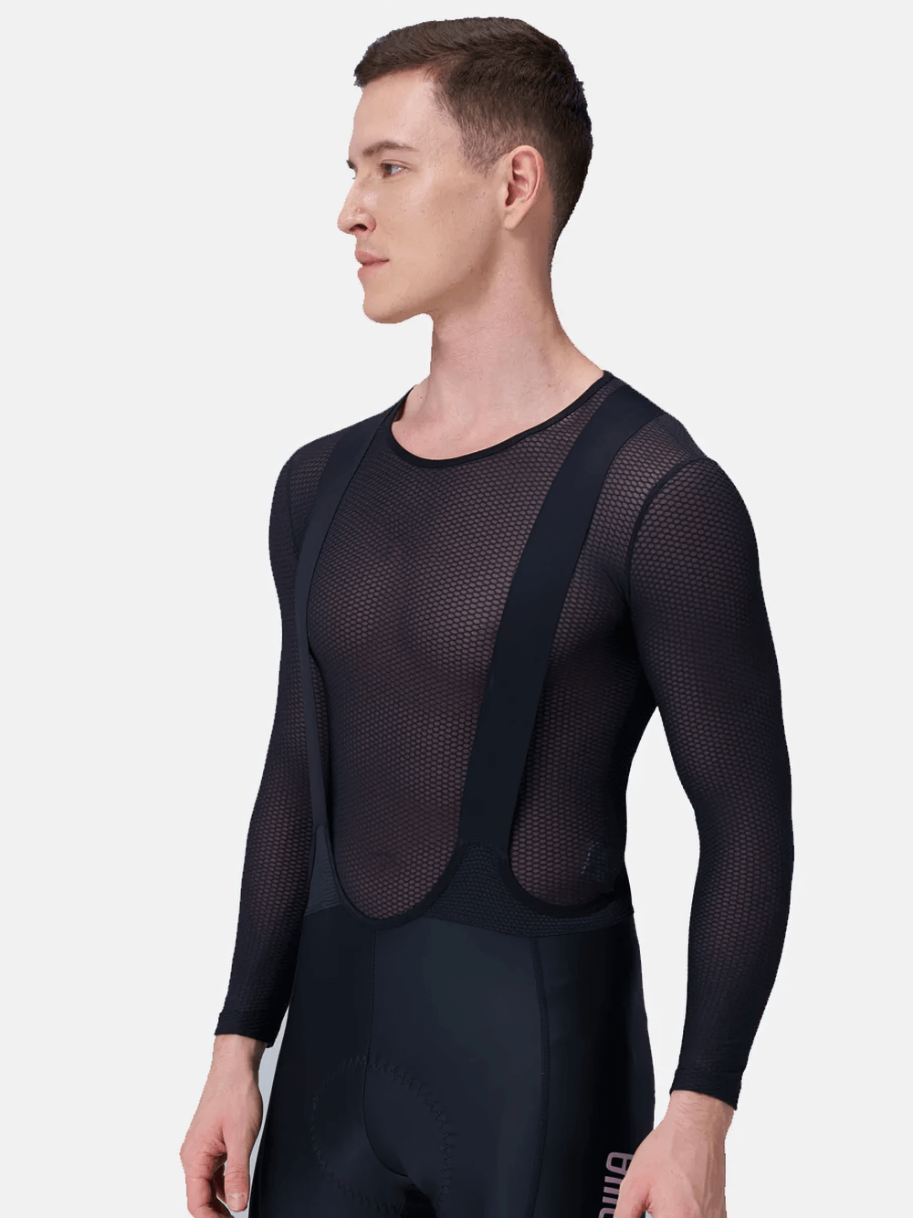 Men's mesh long-sleeved cycling base layer SF2572 shown on model, ideal for quick-drying and breathability during intense bike rides.