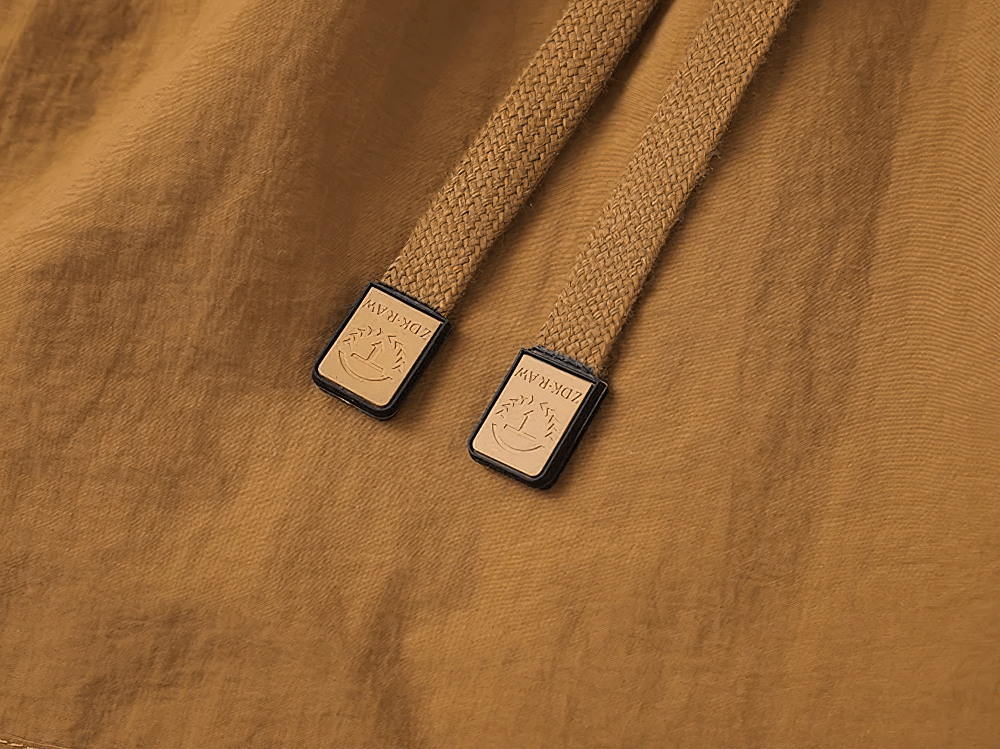 Alt Tag: Men's Outdoor Drawstring Shorts with Cargo Pockets - SF4477 close-up of tan drawstring cord tips on lightweight fabric