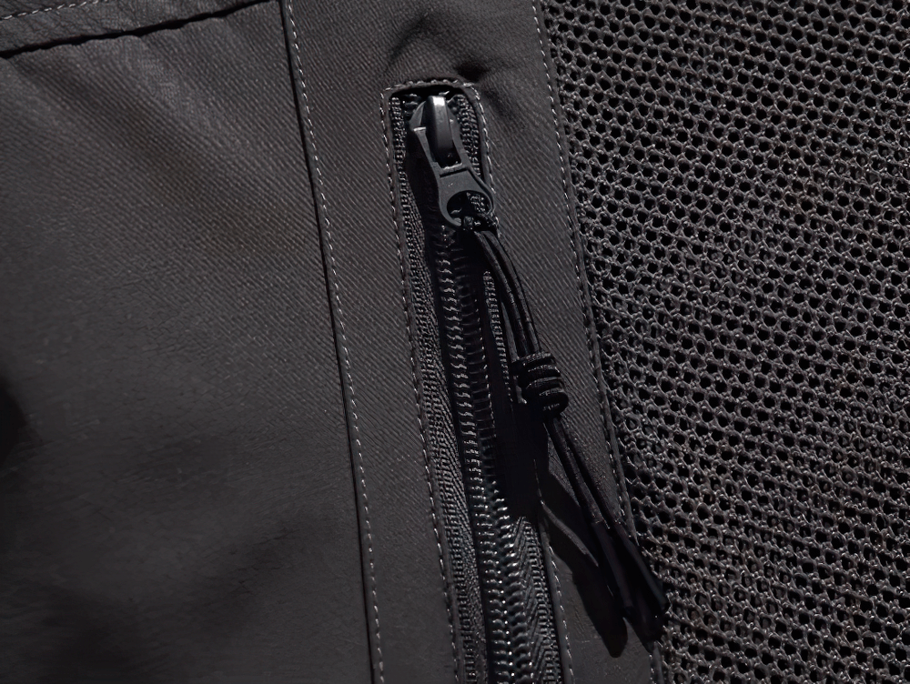 Close-up of zipper detail on Men's Waterproof Hiking Jacket SF2272, showcasing durable design and stylish functionality for outdoor adventures.