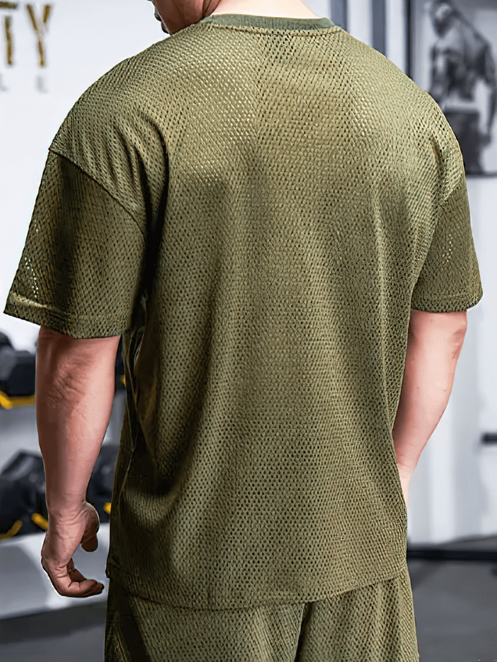 Alt Tag: Men's Oversized Mesh Gym T-Shirt Quick Dry - SF4331 olive green perforated mesh oversized workout tee back view in gym