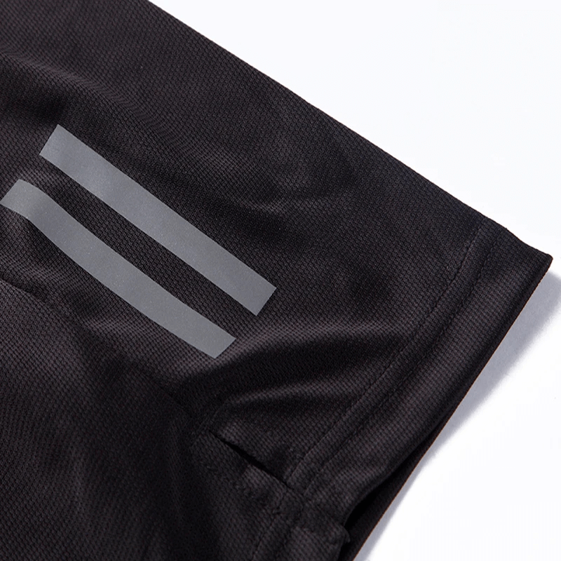 Close-up of breathable black nylon athletic shorts with sporty stripes, ideal for high-energy running and sports activities.
