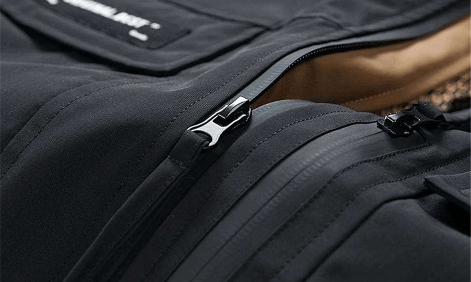 Close-up of zippers on a black men's puffer jacket with a water-resistant outer shell, highlighting winter warmth and functionality.