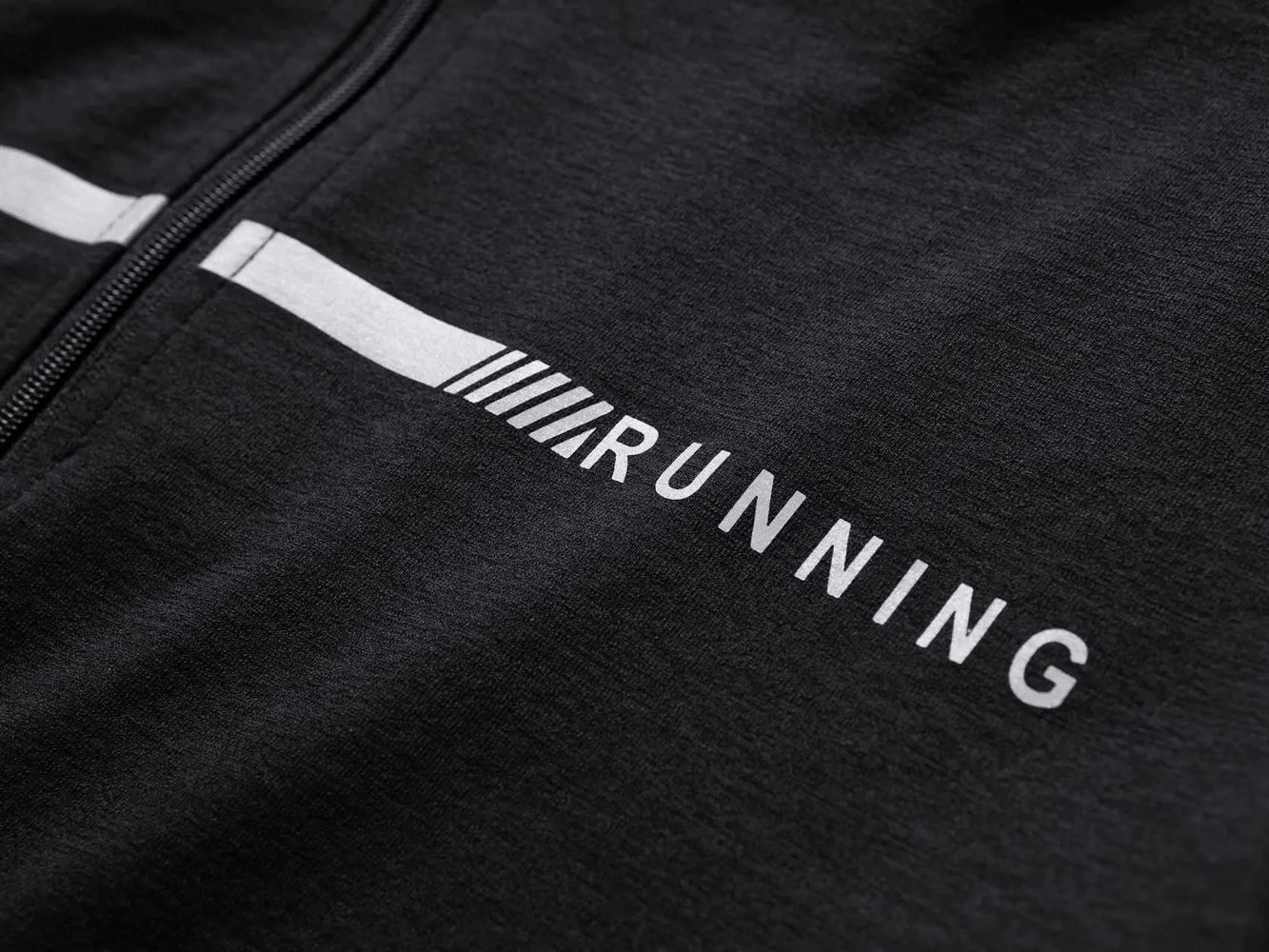 Men's Quarter Zip Running Top with Reflective Trim - SF4589 close-up of the design with RUNNING text on a black fabric.