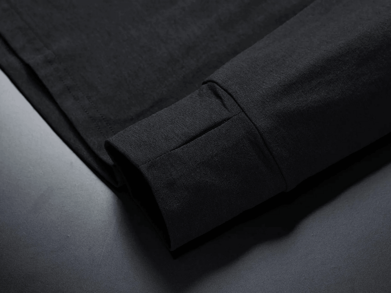 Close-up of the cuff on the Men's Quarter Zip Running Top with Reflective Trim - SF4589, showcasing the quality and design.