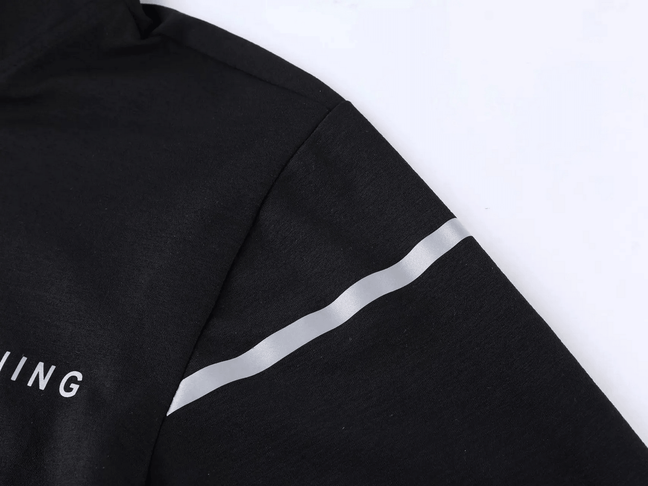 Men's Quarter Zip Running Top with Reflective Trim - SF4589 showcasing a close-up of its reflective trim detail on the sleeve.