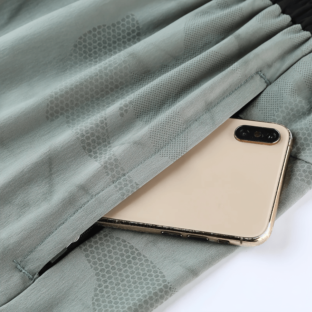 Alt Tag: Men's Quick-Dry Athletic Shorts with Camo Print - SF4468 side pocket close-up holding smartphone, lightweight marble camo fabric