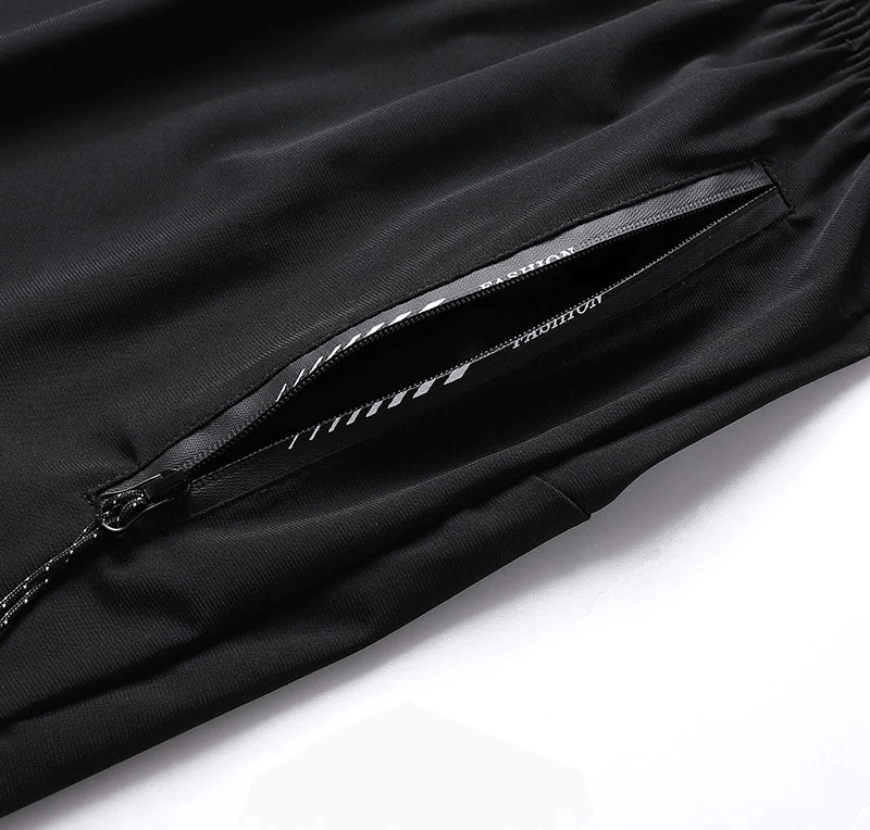 Close-up of black men's quick dry athletic shorts with elastic waist and zip pocket for secure storage.