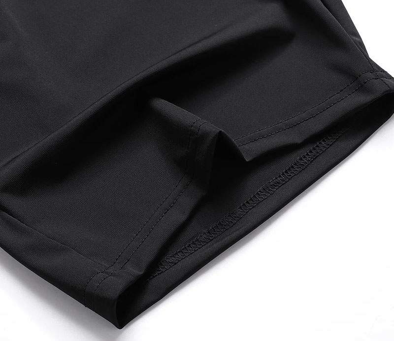 Close-up of men's quick dry athletic shorts, showing nylon-spandex fabric and black stitching, ideal for workouts with zip storage.