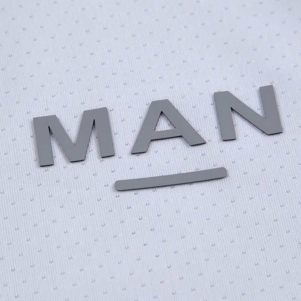 Close-up of word "MAN" on a stylish men's quick-dry tank top, highlighting the textured design and breathable fabric.