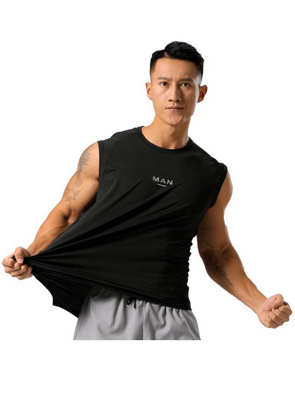 Man wearing black quick dry tank top for training, showing stretch fabric. Ideal for fitness, jogging, and basketball. Breathable and stylish.
