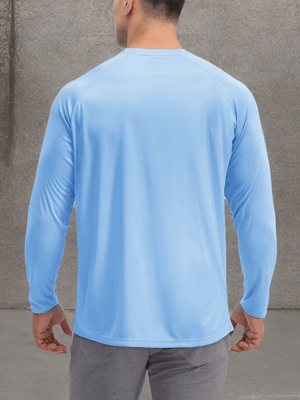 Man wearing a light blue men's quick dry long sleeve sports top, showing back view with an o-neck design and sun protection.