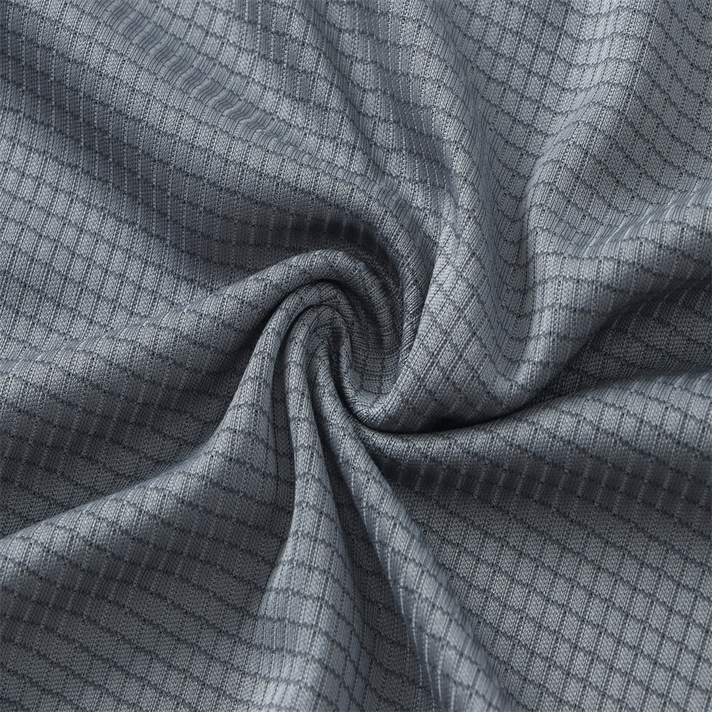 Close-up of gray quick-drying polyester fabric with a grid pattern, highlighting the texture and quality for men's athletic t-shirts.