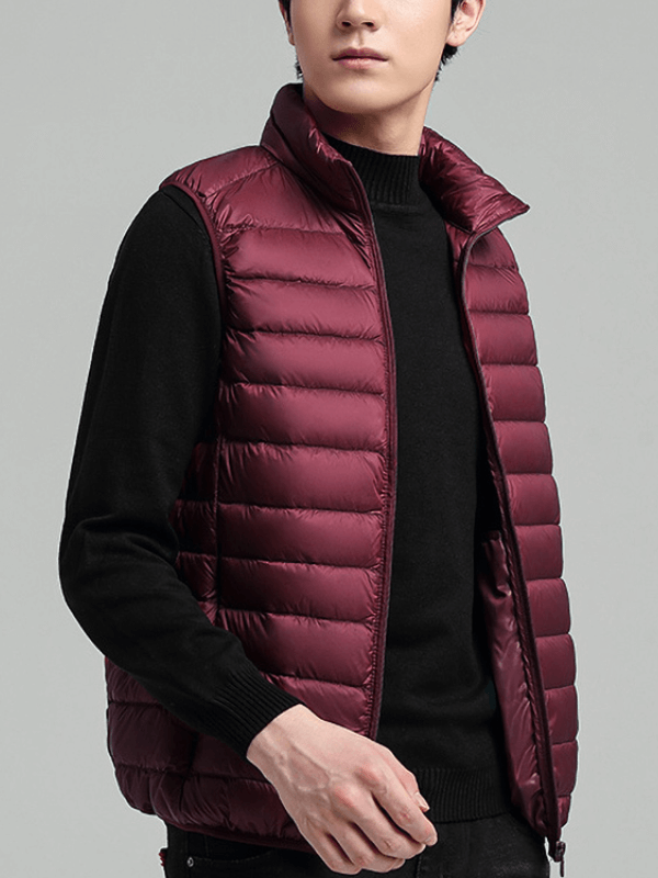 Men's quilted lightweight warm down vest, burgundy, featuring a solid, casual design with zipper closure for chilly weather comfort.