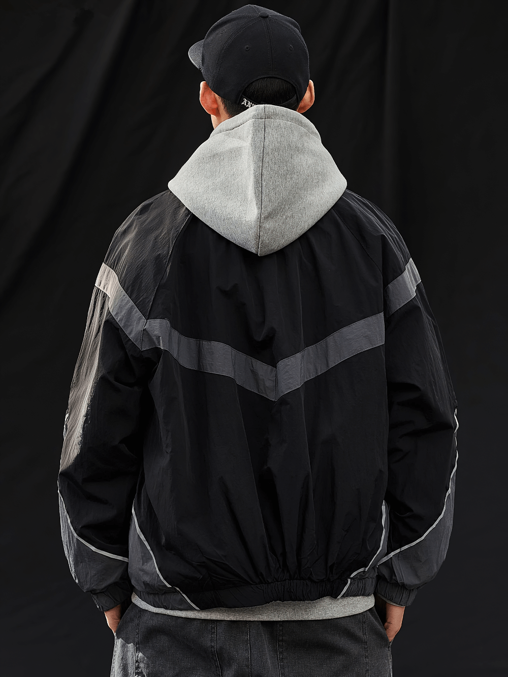 Men's reflective strip patchwork nylon jacket with rib sleeves, streetwear style, black and gray, perfect for spring and autumn.