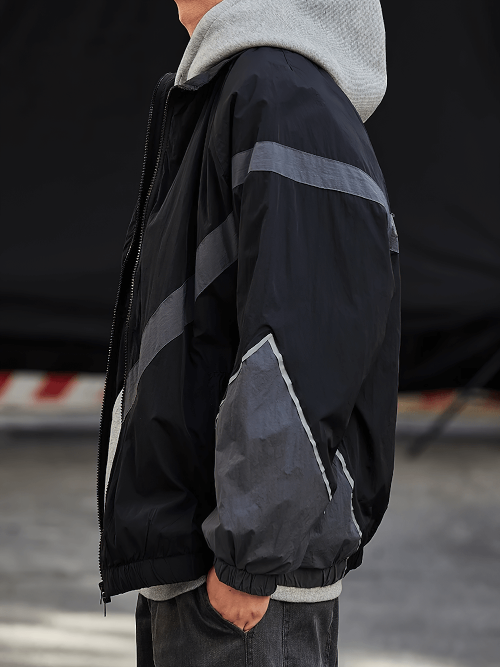 Men's streetwear nylon jacket with reflective strip and rib sleeves, perfect for spring and autumn. Stand collar and zipper closure.