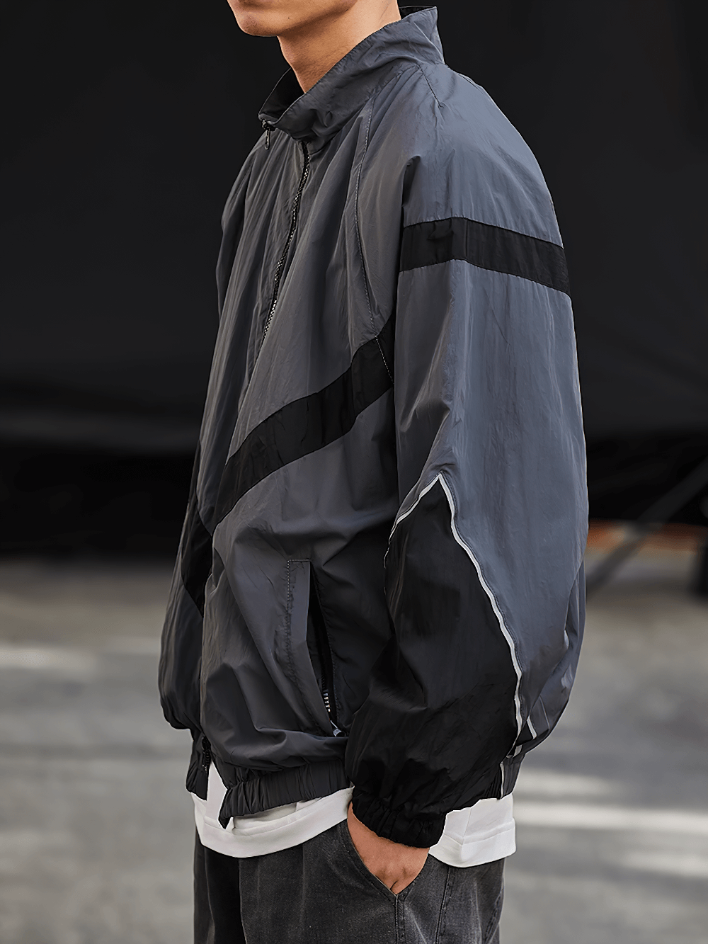 Men's reflective strip nylon jacket with ribbed sleeves and stand collar, streetwear style for spring and autumn.