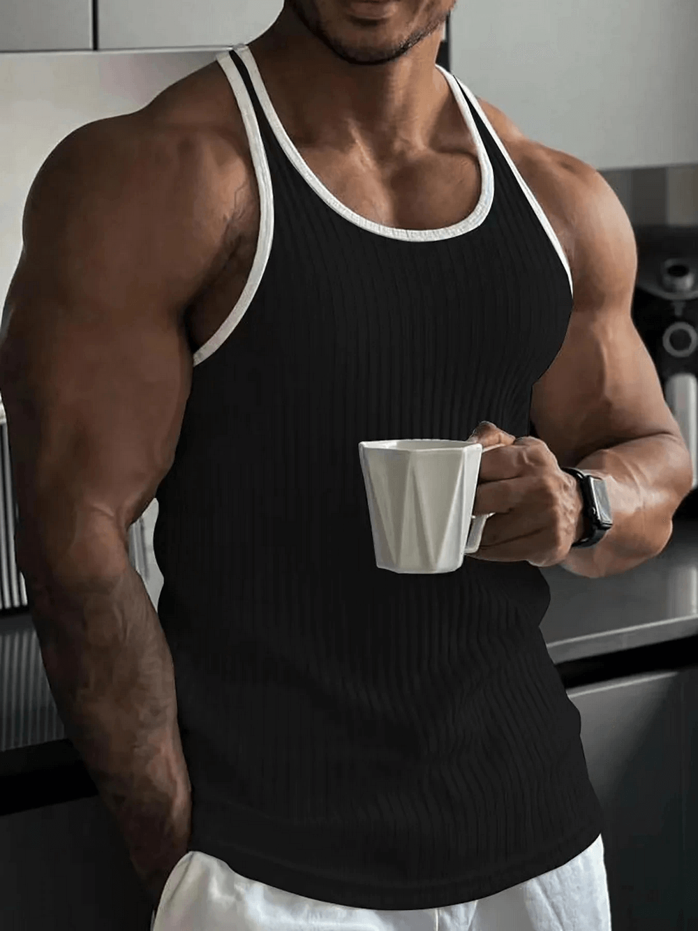 Man wearing Men's Ribbed Athletic Tank Top for Gym and Fitness - SF4111, holding a mug, showcasing gym style and performance.