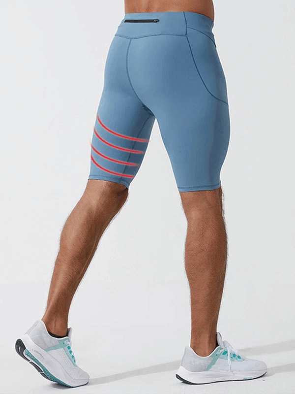 Men's blue running compression shorts with pockets, nylon-spandex blend, showcasing solid pattern and stylish design for male athletes.