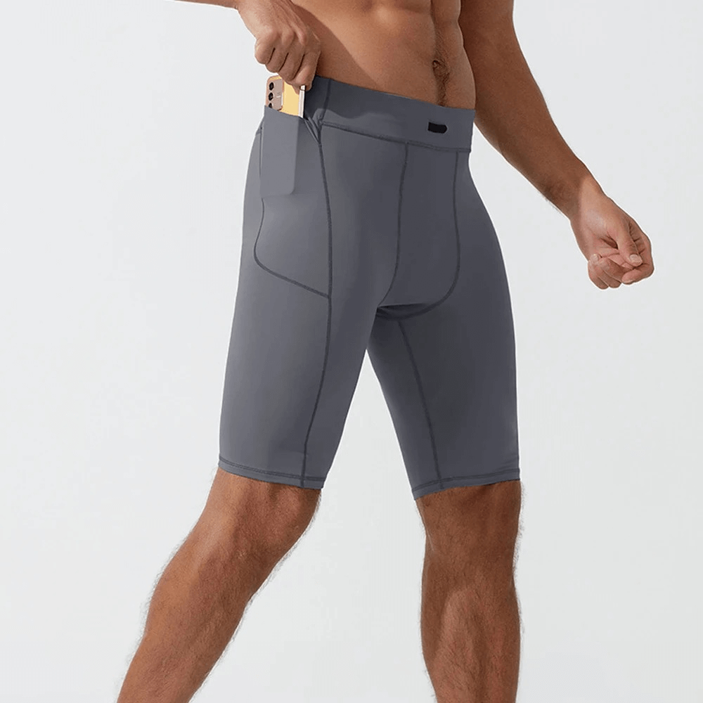 Men's running compression shorts with pockets, breathable nylon spandex, solid gray design, maximum comfort for workouts.