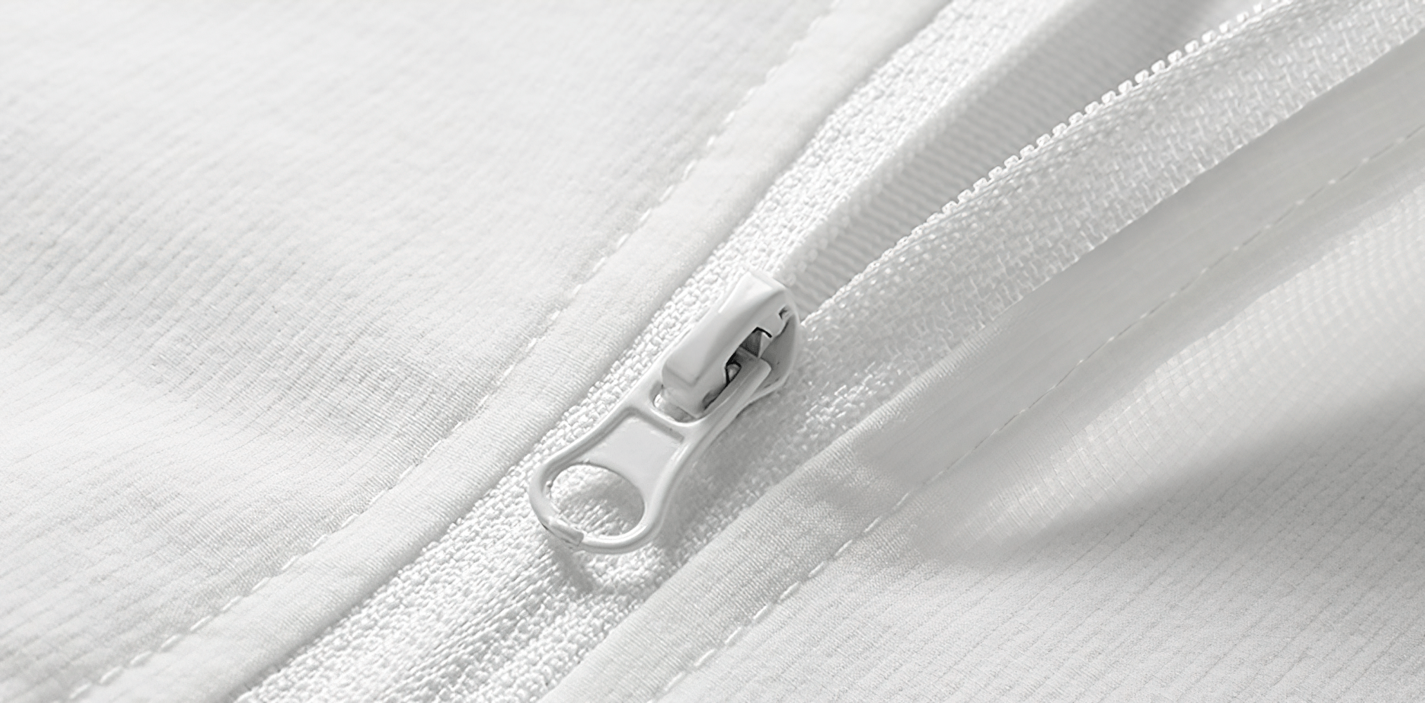 Close-up of half-zip detail on men's lightweight running top, showcasing breathable knit polyester fabric and stylish design.