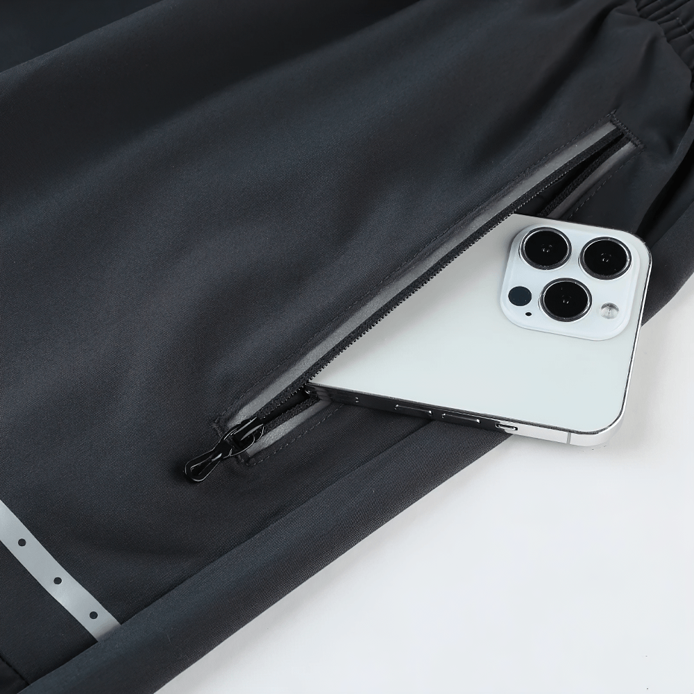 Alt Tag: Men's Slim Fit Training Shorts with Zipper Pockets - SF4448 close-up of zip pocket holding phone, reflective trim detail