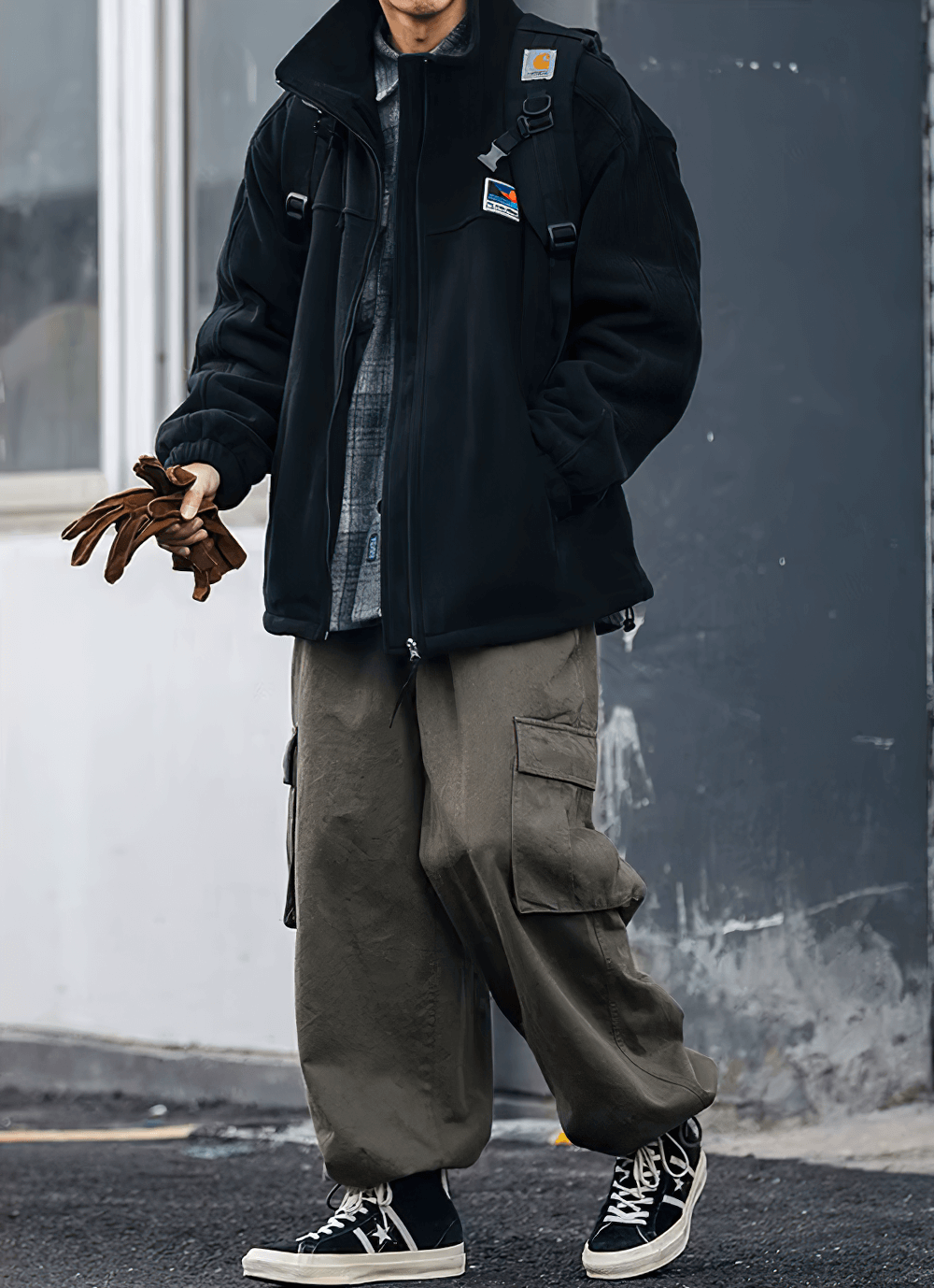 Man wearing black men's stand collar fleece jacket SF2274 with zipper, casual streetwear style, and cargo pants.